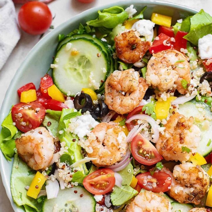 Greek salad with shrimp and vegetables in large bowl