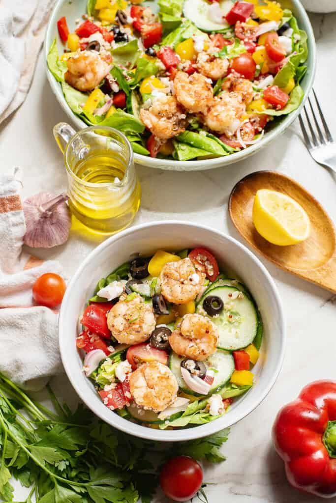 Greek salad with shrimp and vegetable served in salad bowl