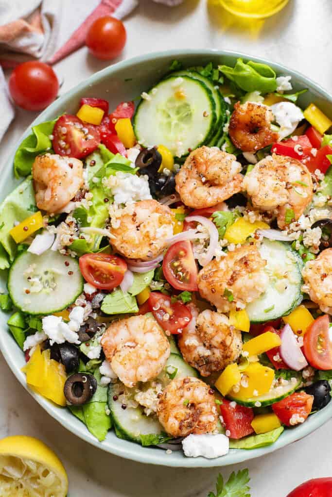 Large bowl of Mediterranean Shrimp Quinoa Salad with veggies