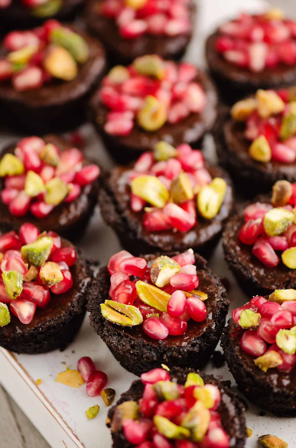 Mini Pomegranate Chocolate Tarts served on platter
