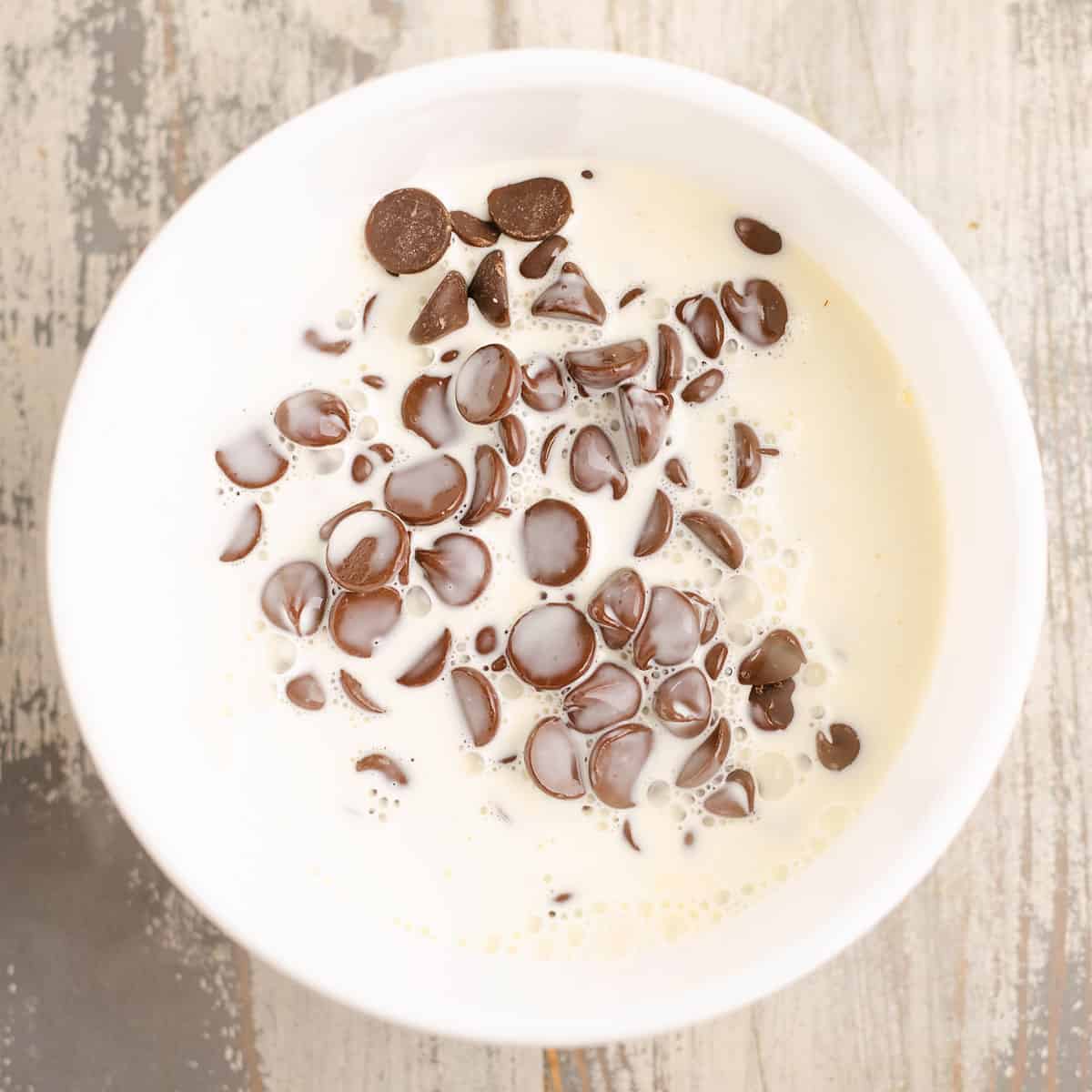 hot cream poured over chocolate chips