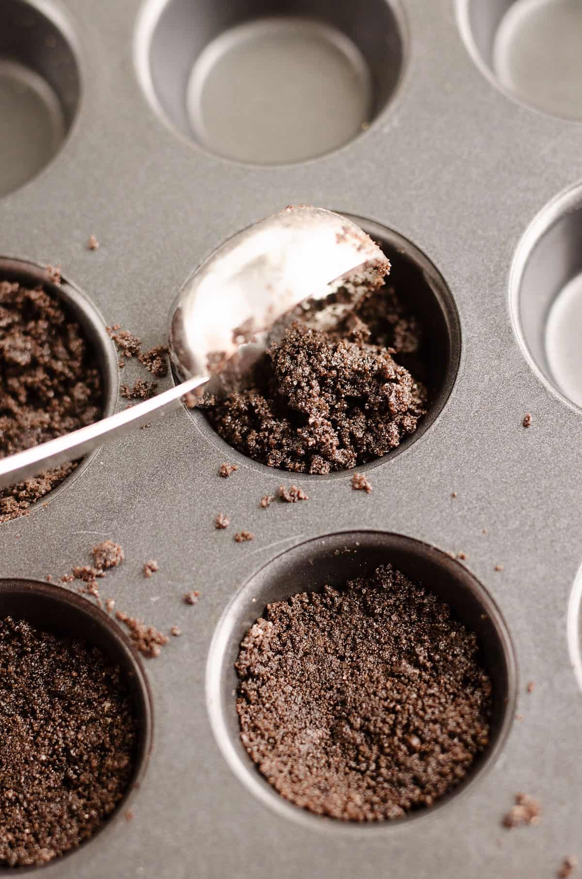 cookie crust scooped into muffin tins