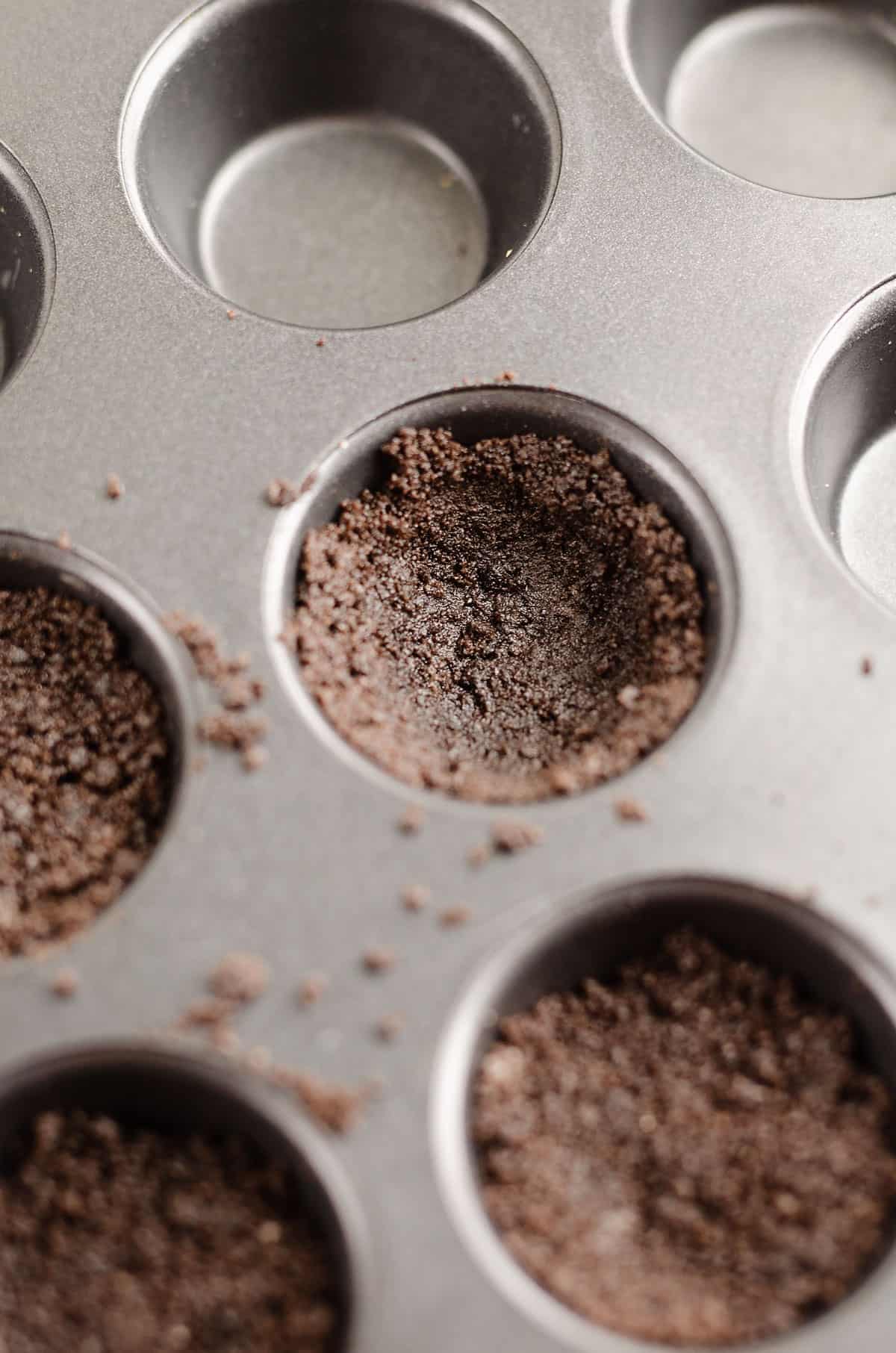 cookie crust pressed into muffin tins