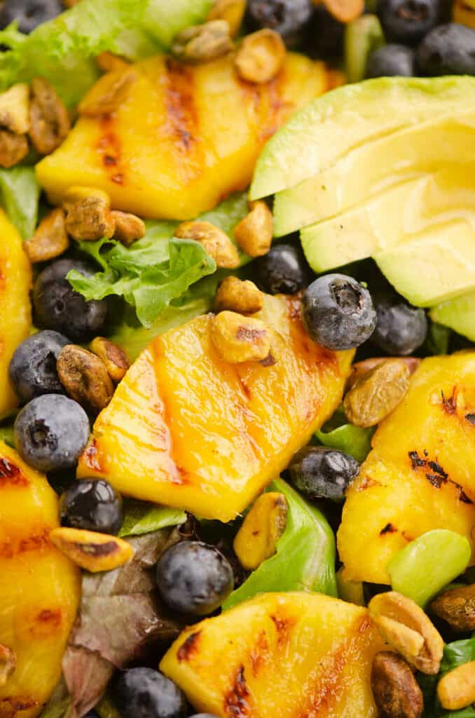 mixed greens with grilled pineapple, blueberries, avocado and pistachios