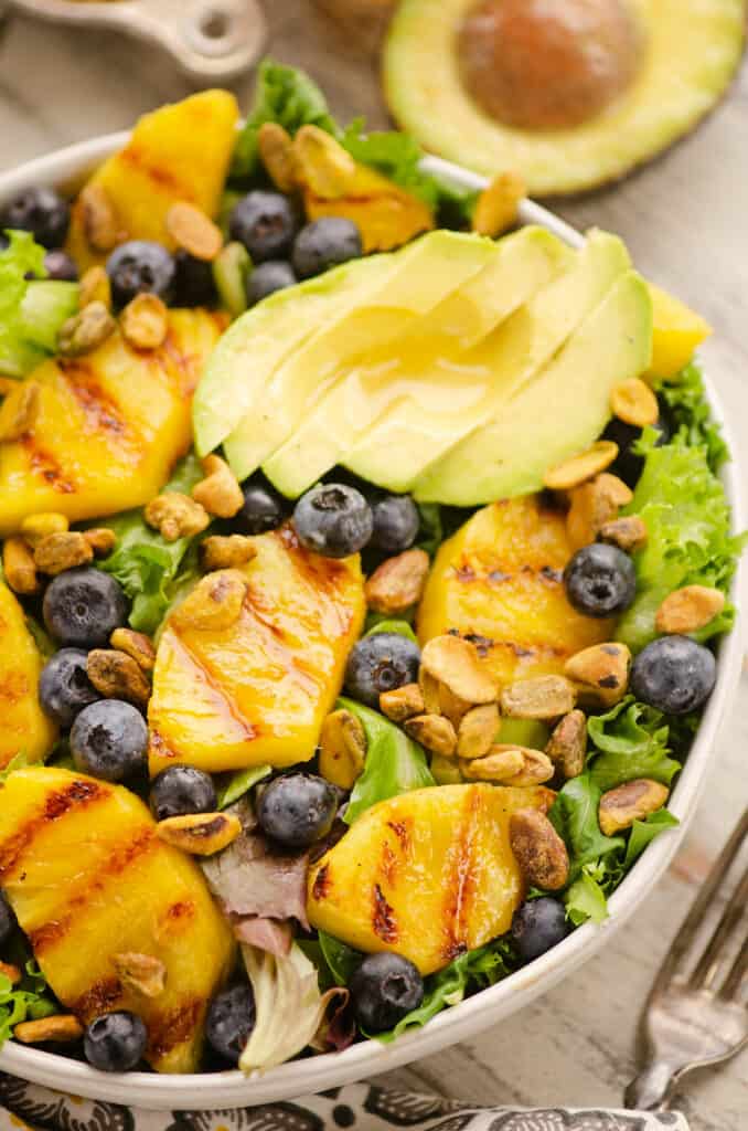 grilled pineapple salad served on table with fork