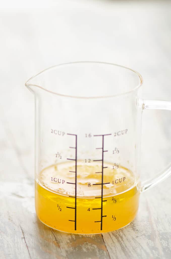 pineapple honey vinaigrette in measuring cup