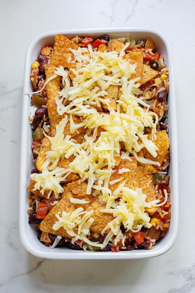 Dorito casserole topped with Manchego cheese