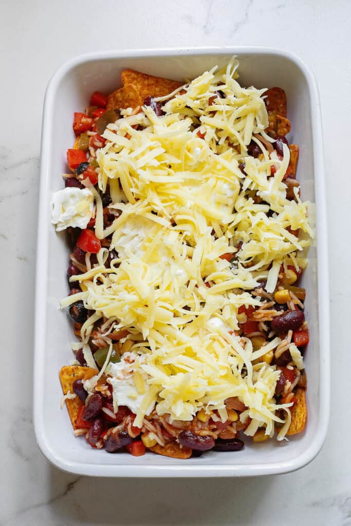 Dorito casserole layered with Manchego cheese