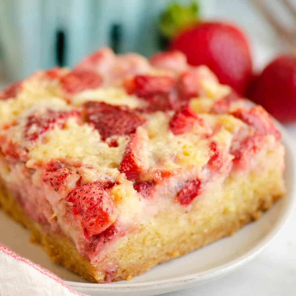 square piece of strawberry custard dessert