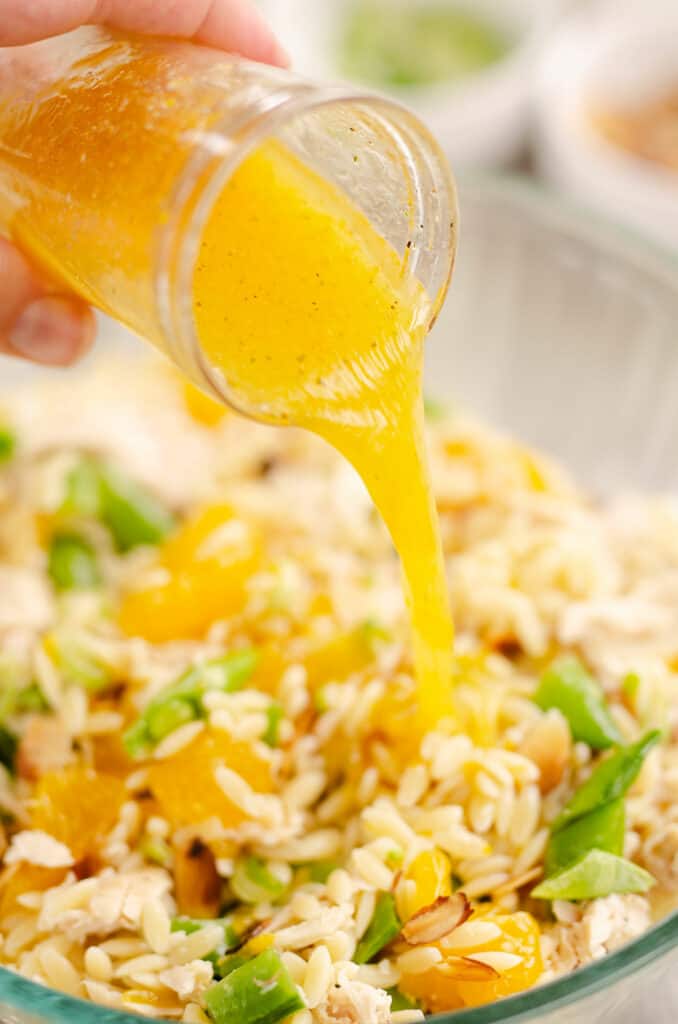 orange ginger vinaigrette poured over chicken pasta salad