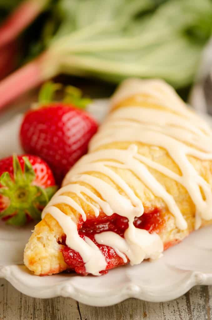 strawberry rhubarb filling coming out of turnover on plate