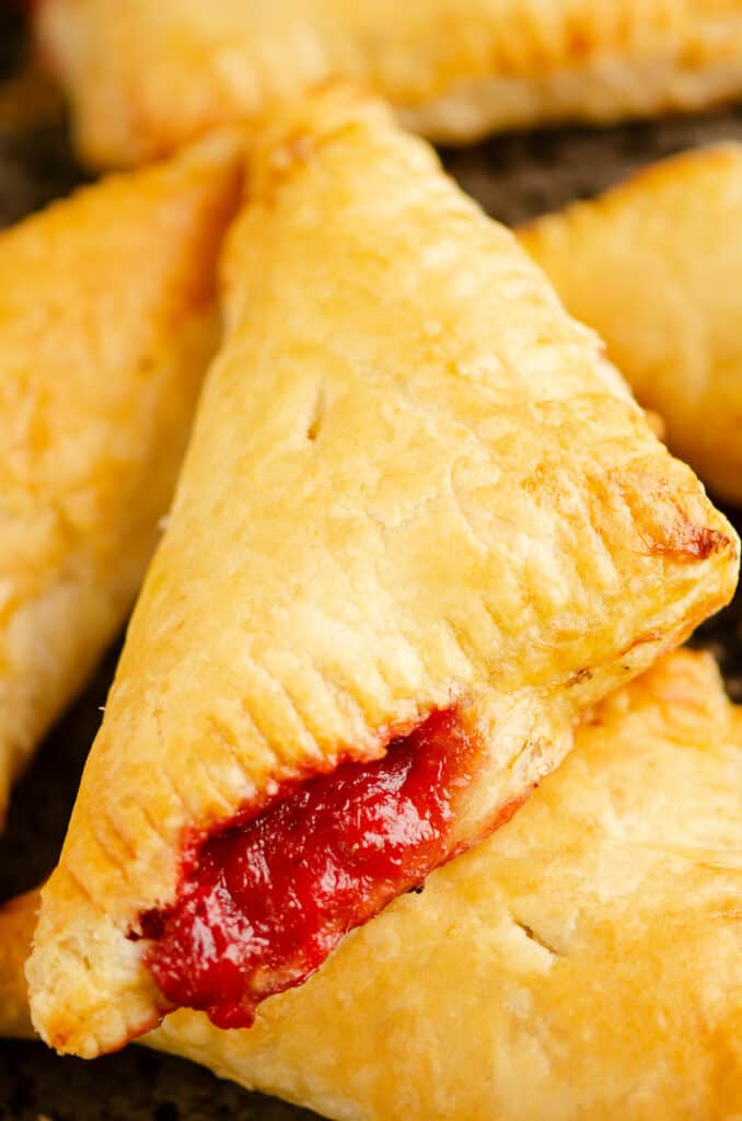 rhubarb turnovers piled on pan