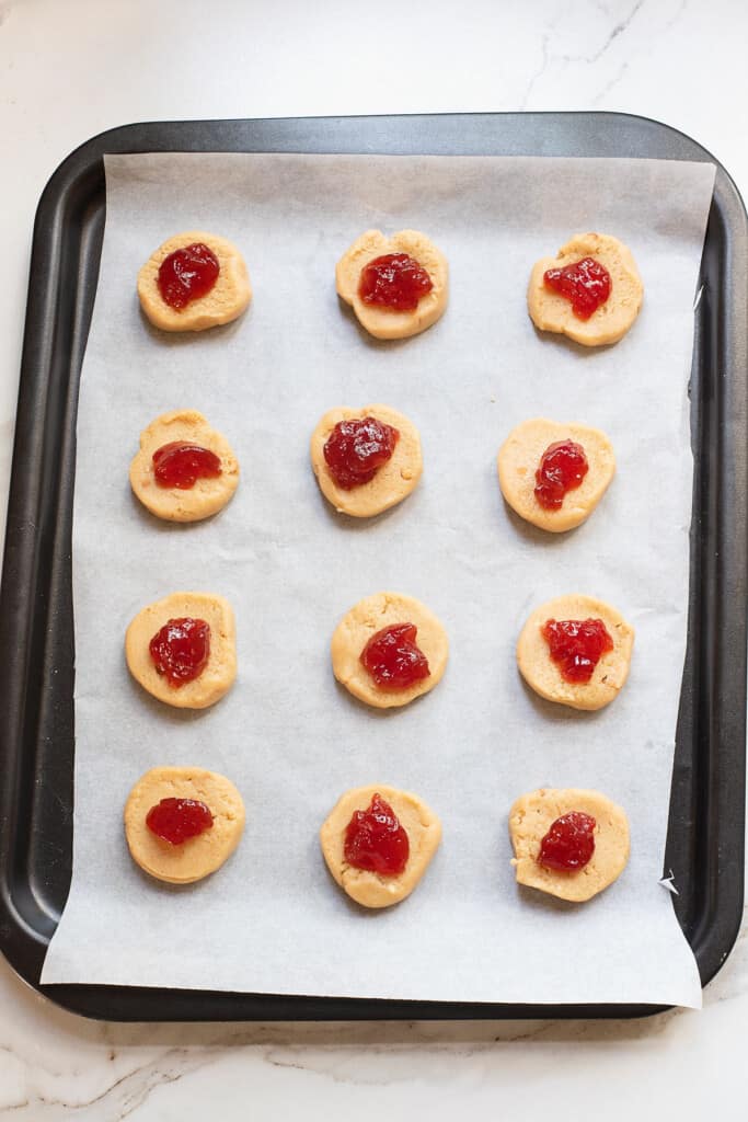 dollop of jelly on peanut butter cookie