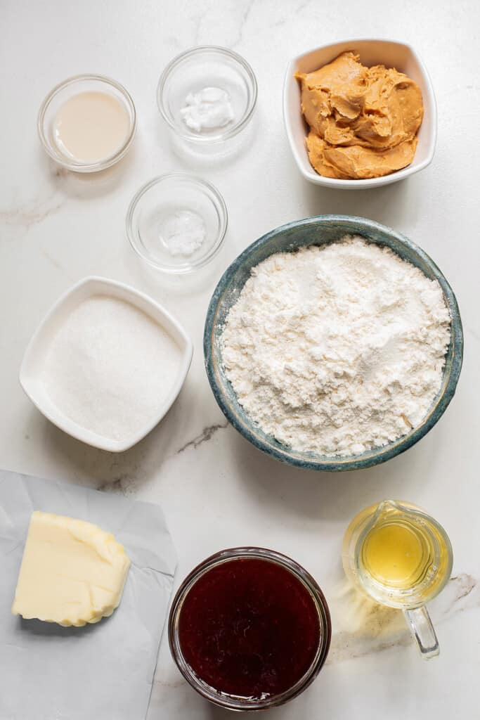 peanut butter jelly cookie ingredients on table