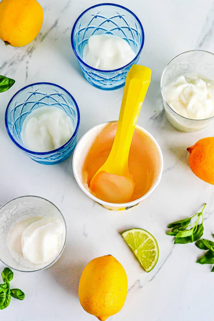 lemon sorbet scooped into punch glasses on table