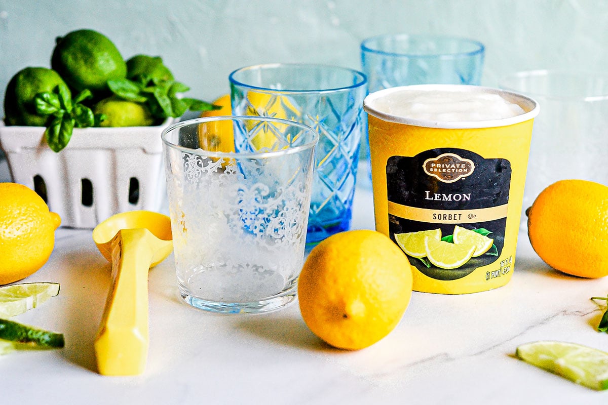 citrus, glasses and sorbet on table