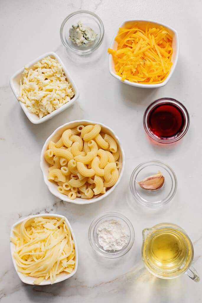 macaroni and cheese fondue ingredients on table in bowls