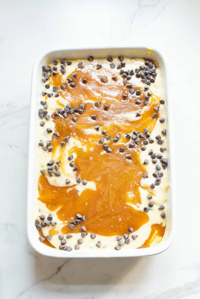 Caramel and chocolate chip topped coffee cake batter