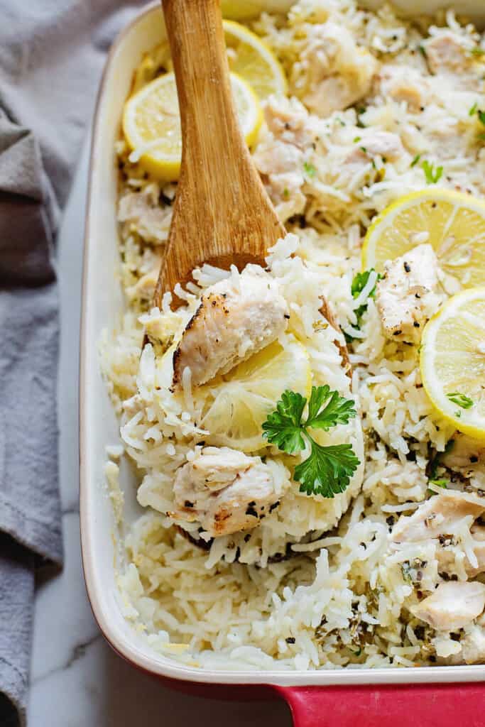 lemon chicken and rice spooned from baking dish