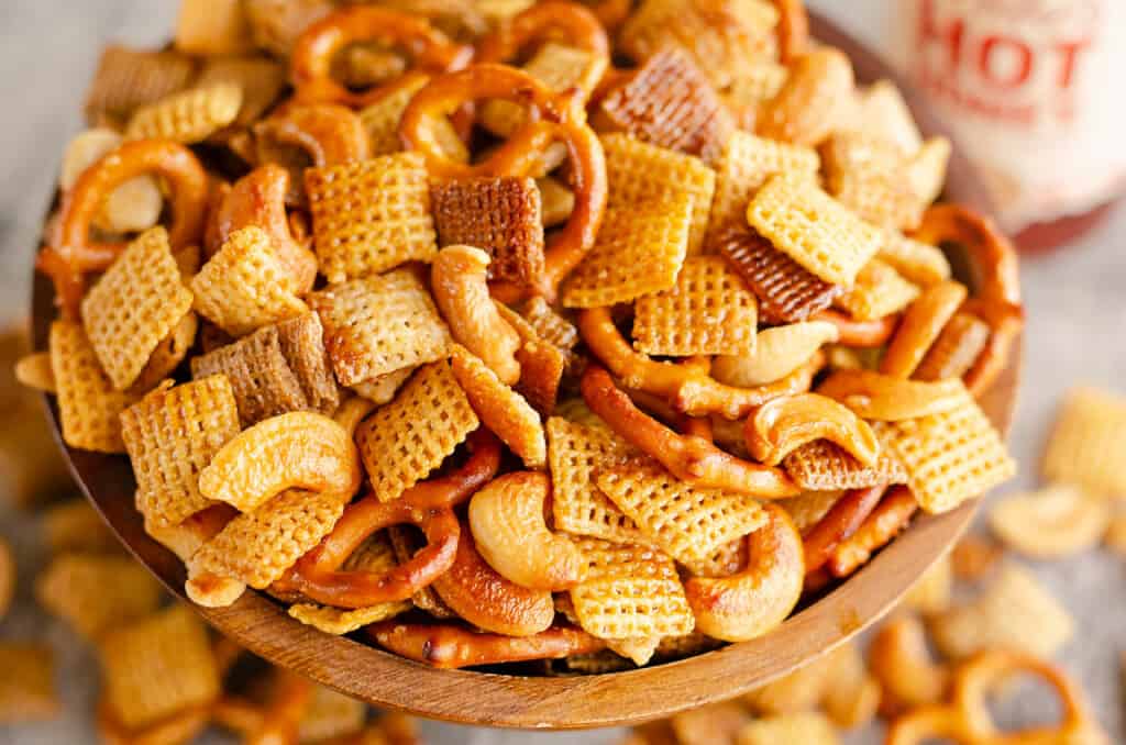 hot honey snack mix in wooden bowl