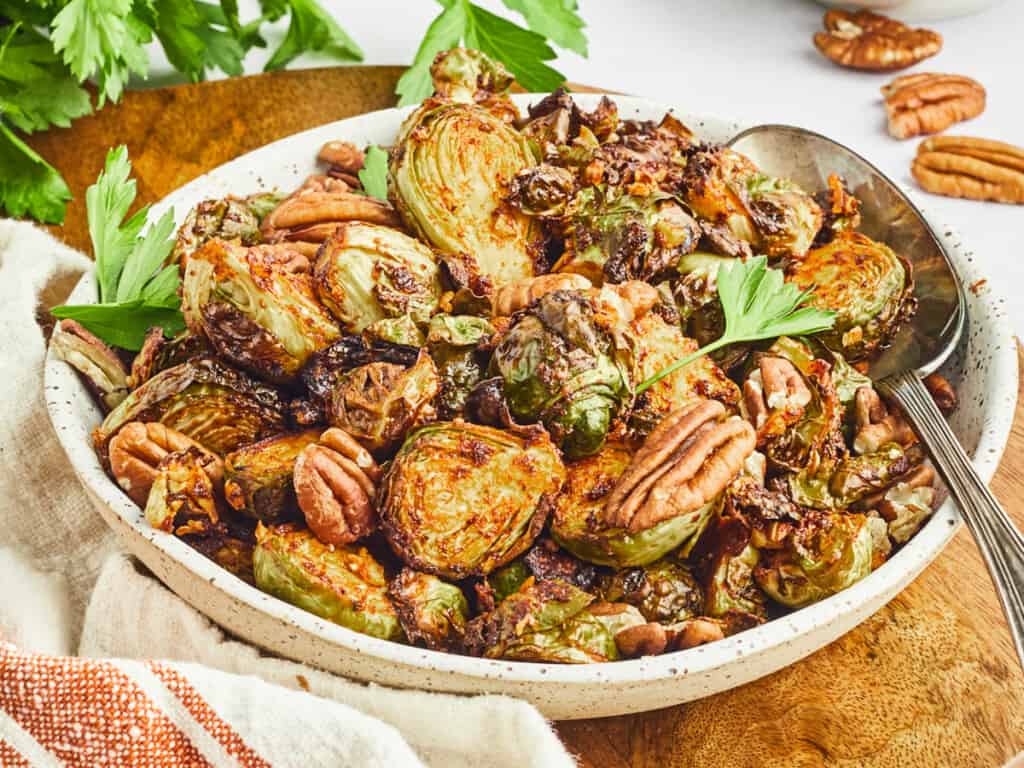 air fryer maple dijon and pecan brussels sprouts in bowl