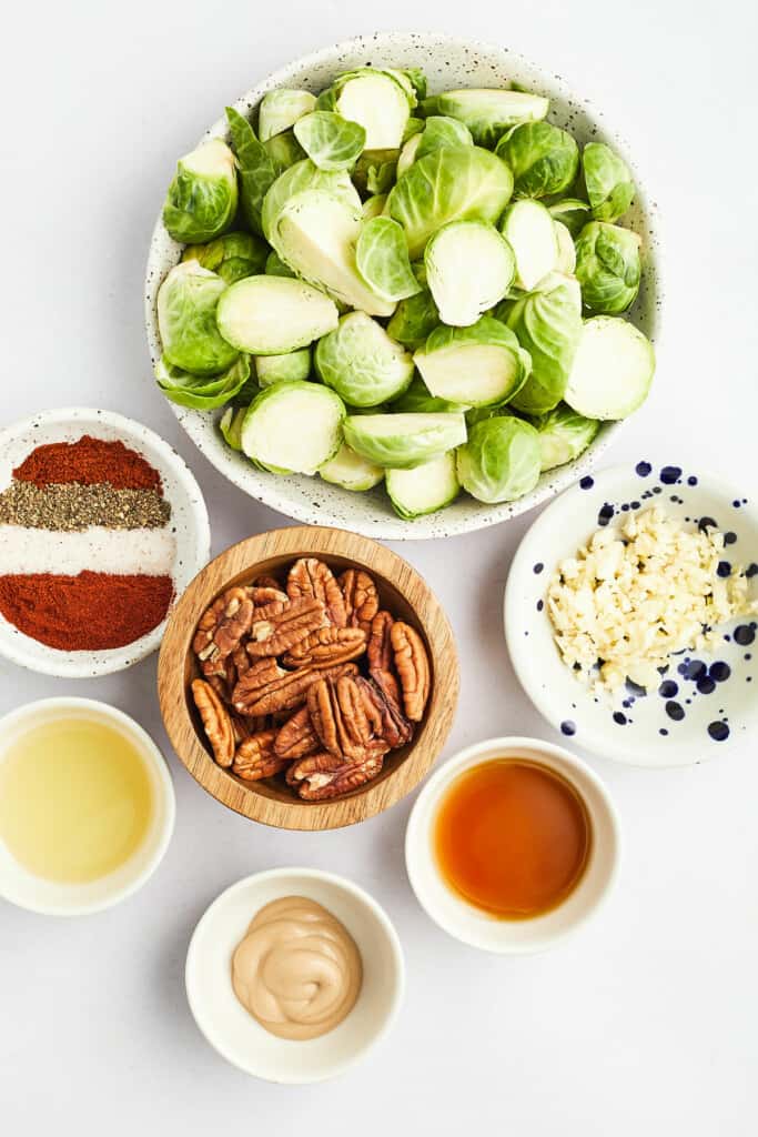maple dijon and pecan brussels sprouts ingredients on white table