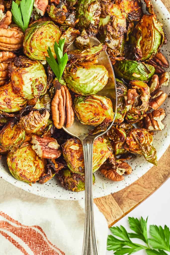 maple dijon and pecan brussels sprouts on serving spoon