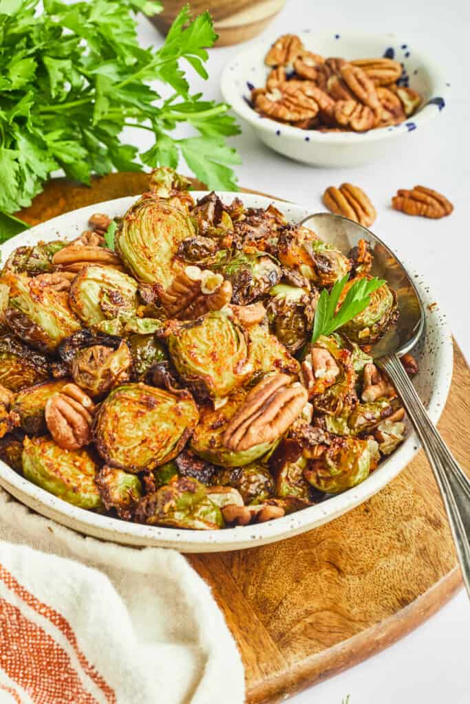 maple dijon and pecan brussels sprouts in bowl with spoon