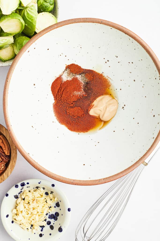 paprika, dijon, maple seasoning in white speckled bowl