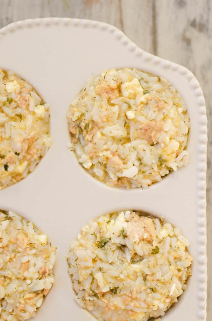 rice and salmon mixture in muffin tin