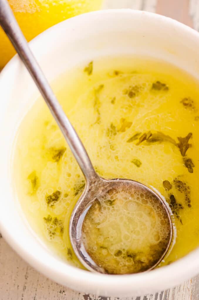 lemon butter sauce in bowl with spoon